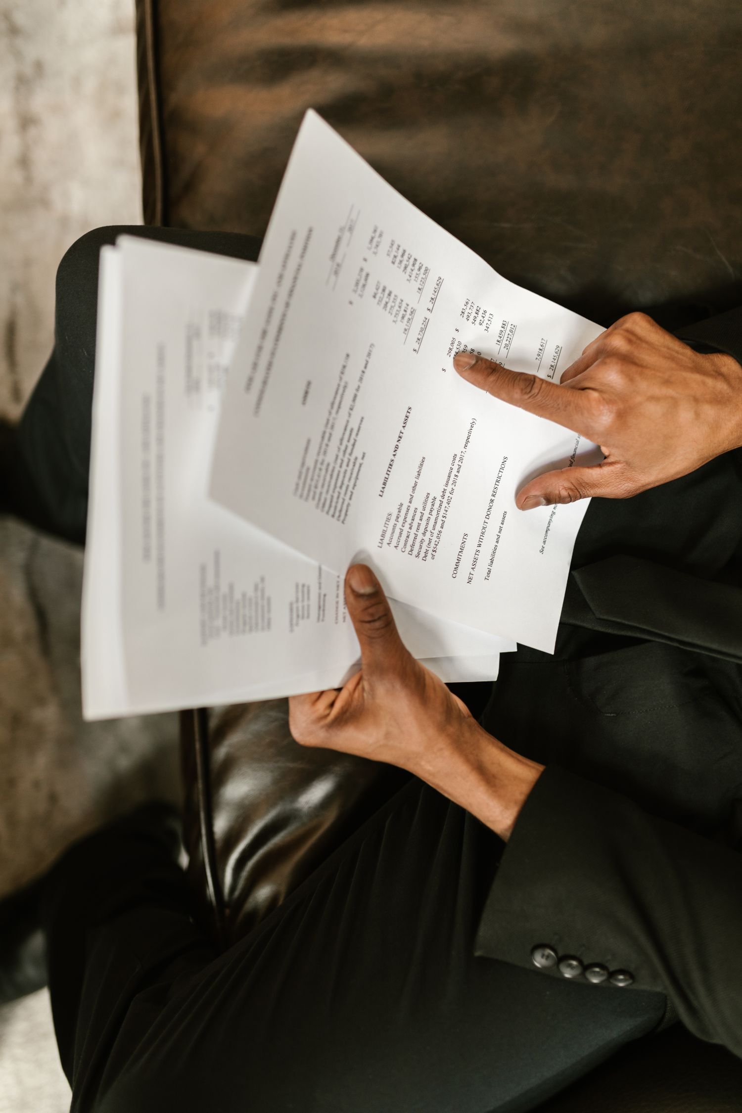 A person reviewing the figures in a legal document